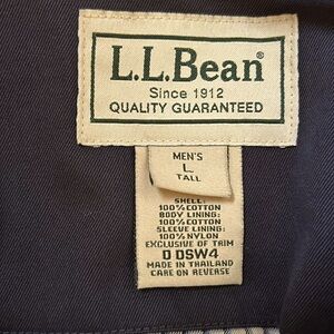 LL Bean LT Navy blue cotton jacket with checkered blue cotton liner.